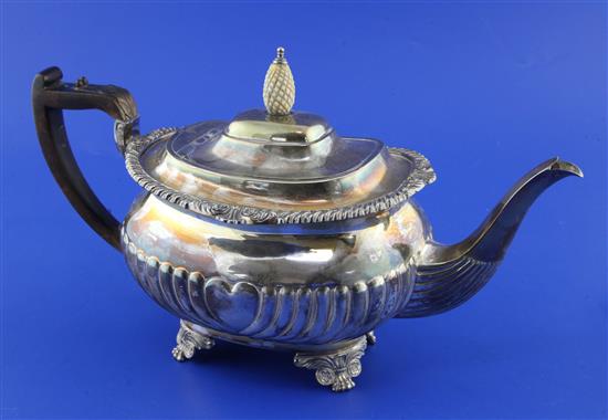 A late Victorian demi-fluted silver teapot, gross 22 oz.